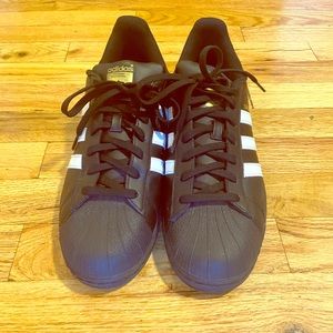 Black and White Adidas Superstars.